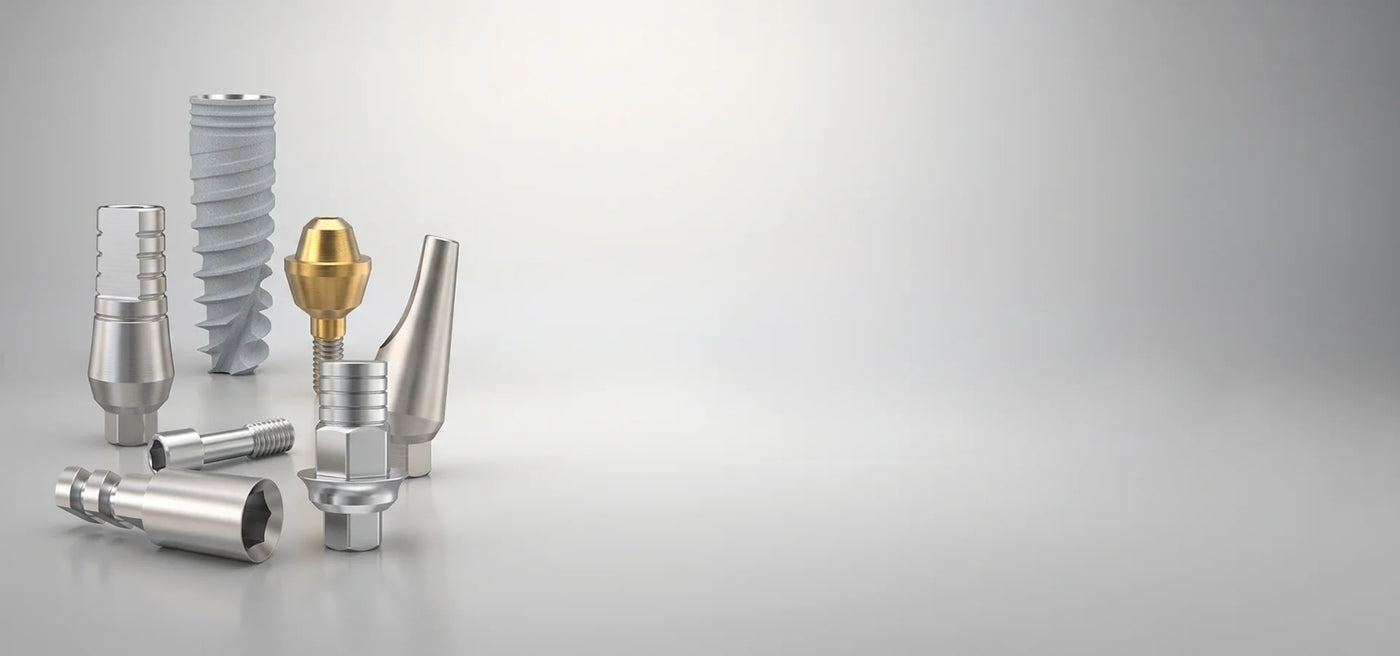 gdt dental implants and components on a gray background